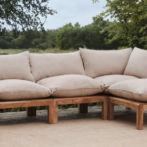 An acacia wooden outdoor sofa by Nkuku