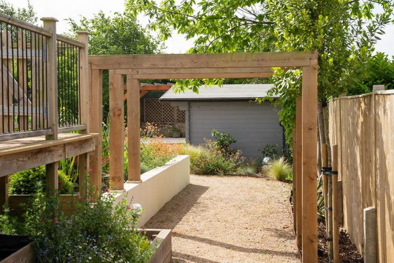 Wooden arbours in a garden in Sussex