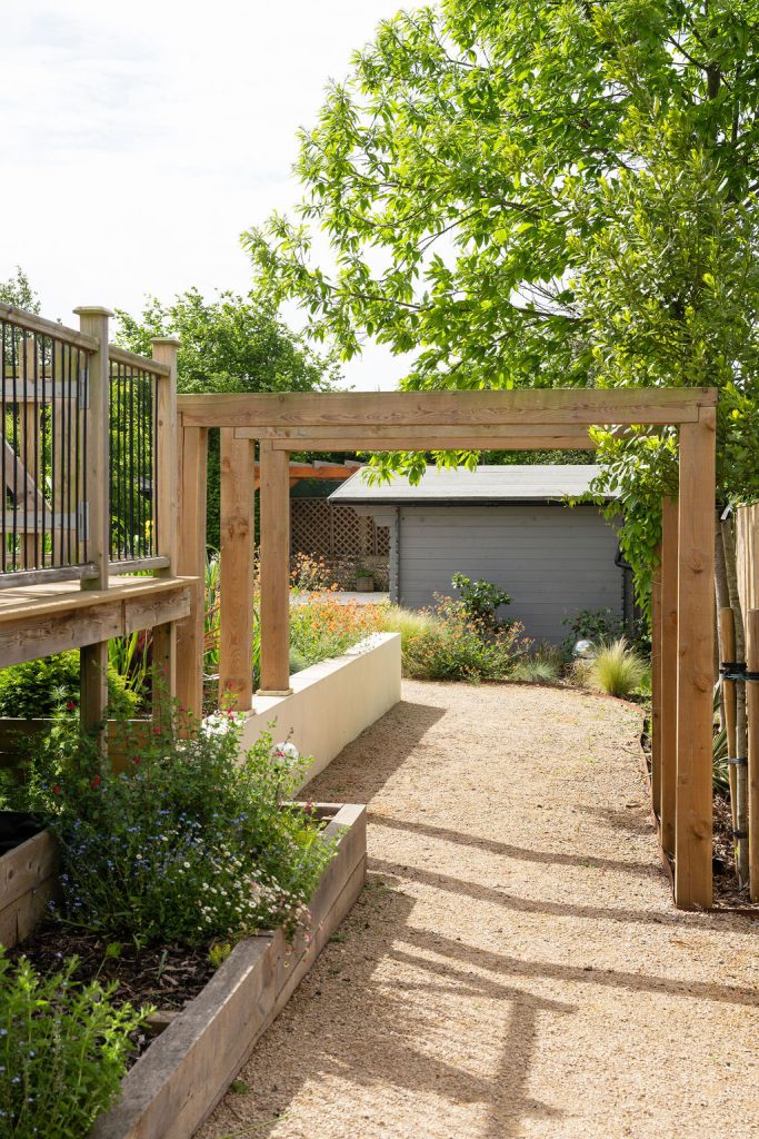 Raised timber beds under an oak pergola