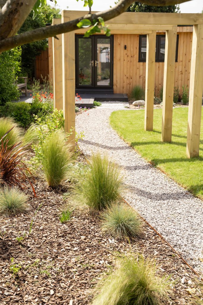 Studio Hummingbird | Garden Style Quiz Timber posts and grasses along a gravel path
