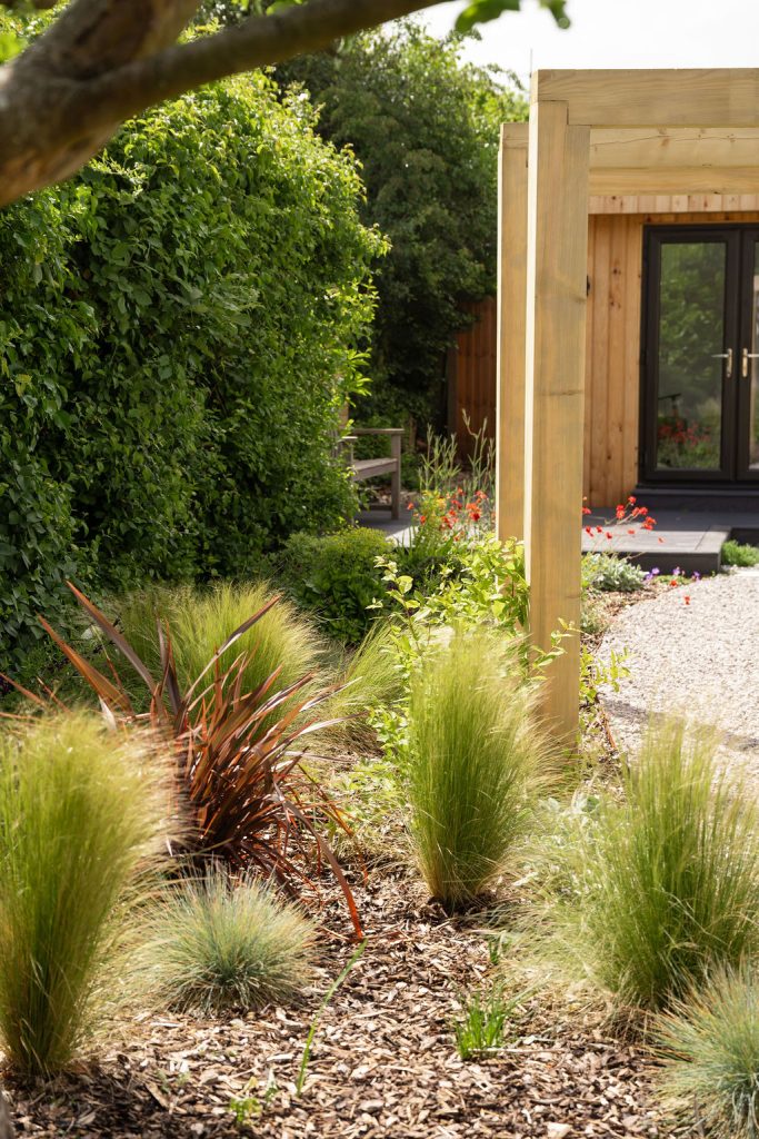 Studio Hummingbird | Garden Style Quiz Phormium and grasses beside timber posts