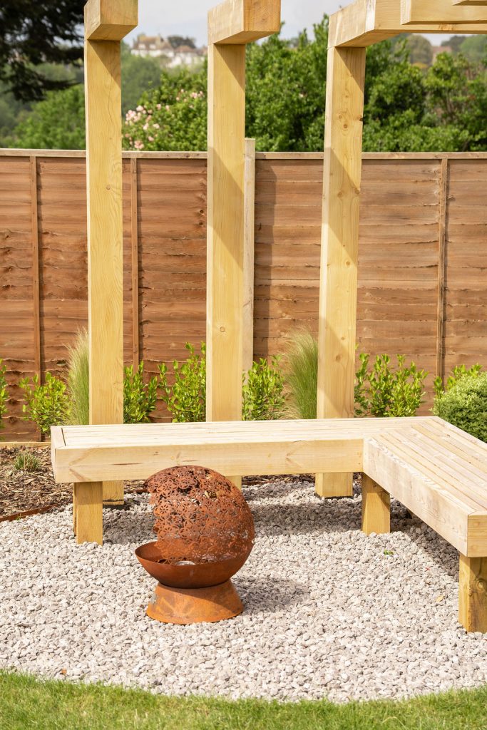 Studio Hummingbird | Garden Style Quiz Oak bench and a corten fire sphere